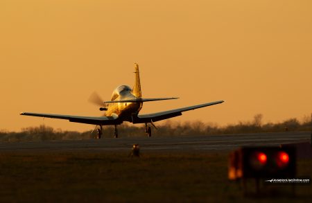 PC-9M landing at sunset